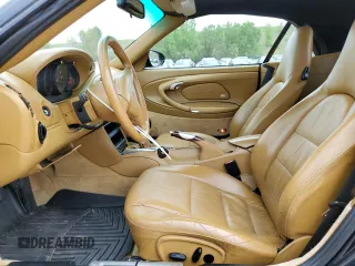 2000 Porsche 911 z VIN WP0CA2998YS650752, wystawiony jako Copart lot #58339415 z przebiegiem 68 854 mil mil oraz Szkoda całkowita • Salvage title. Historia ofert i sprzedaży dostępna na DreamBid. Obrazek 7.