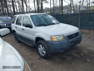 2003 Ford Escape XLS Popular with VIN 1FMYU021X3KC76123, listed as a IAAI auction lot 41844824 with 185,036 mi miles. Bid and sale history available at carsss.com. Image 1.