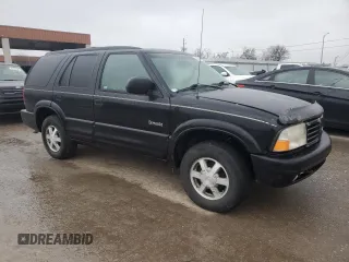 2000 Oldsmobile Bravada z VIN 1GHDT13W5Y2311819, wystawiony jako Copart lot #44839145 z przebiegiem 163 427 mil mil oraz Tytuł czysty. Historia ofert i sprzedaży dostępna na DreamBid. Obrazek 4.