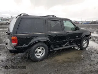 2000 Ford Explorer Limited with VIN 1FMDU75EXYZA76329, listed as a Copart auction lot 80952474 with 90,637 mi miles and Salvage title. Bid and sale history available at DreamBid. Image 3.