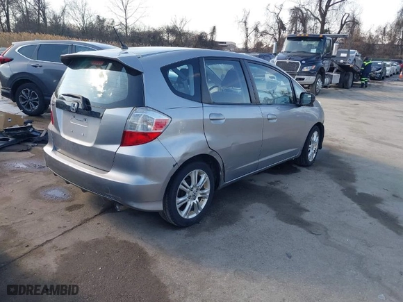 2009 Honda Fit Sport w/Navi with VIN JHMGE88629S018457, listed as a IAAI auction lot 41431959 with 165,213 mi miles. Bid and sale history available at carsss.com. Image 4.