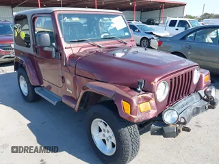 2004 Jeep Wrangler Sahara with VIN 1J4FA59S24P739581, listed as a IAAI auction lot 41696146 with 232,139 mi miles. Bid and sale history available at carsss.com. Image 1.
