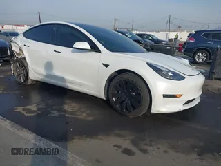 2021 Tesla Model 3 Long Range with VIN 5YJ3E1EB0MF009965, listed as a IAAI auction lot 41478233 with 31,713 mi miles and . Bid and sale history available at DreamBid. Image 1.