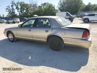 2000 Ford Crown Victoria with VIN 2FAFP73W4YX216080, listed as a Copart auction lot 53774835 with 144,404 mi miles and Salvage Title. Bid and sale history available at carsss.com. Image 2.