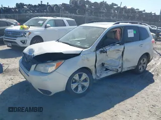 2014 Subaru Forester 2.5i Touring with VIN JF2SJAMC6EH413261, listed as a IAAI auction lot 40672035 with 1 mi miles. Bid and sale history available at carsss.com. Image 2.