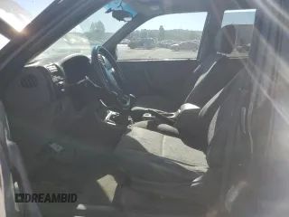 2004 Isuzu Rodeo S with VIN 4S2CK58W344303242, listed as a Copart auction lot 75339714 with 106,659 mi miles and Salvage title. Bid and sale history available at DreamBid. Image 7.