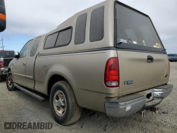 2000 Ford F-150 XL with VIN 1FTRX17L3YKB07018, listed as a Copart auction lot 66998714 with 0 mi miles and Salvage Title. Bid and sale history available at carsss.com. Image 2.