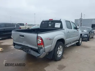 2009 Toyota Tacoma PreRunner with VIN 3TMJU62NX9M081748, listed as a IAAI auction lot 41608525 with 210,999 mi miles. Bid and sale history available at carsss.com. Image 4.