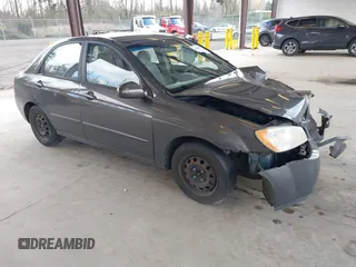 2004 Kia Spectra LX with VIN KNAFE121145031237, listed as a IAAI auction lot 41954550 with 133,744 mi miles. Bid and sale history available at carsss.com. Image 1.