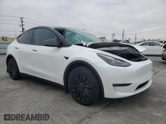 2023 Tesla Model Y Long Range with VIN 7SAYGDEE2PF860135, listed as a Copart auction lot 50380975 with 25,334 mi miles and Salvage Title. Bid and sale history available at DreamBid. Image 4.