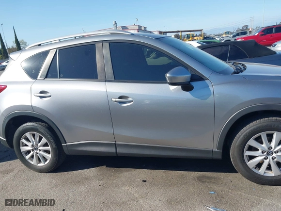 2013 Mazda CX-5 Touring with VIN JM3KE2CE3D0123138, listed as a IAAI auction lot 41818678 with 173,909 mi miles. Bid and sale history available at carsss.com. Image 13.