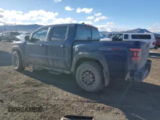 2023 Nissan Frontier Pro-4X z VIN 1N6ED1EK0PN610517, wystawiony jako Copart lot #87213324 z przebiegiem 51 648 mil mil oraz Szkoda całkowita • Salvage title. Historia ofert i sprzedaży dostępna na DreamBid. Obrazek 2.