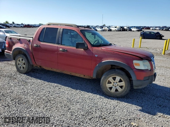 2007 Ford Explorer Sport Trac XLT with VIN 1FMEU51887UA09474, listed as a Copart auction lot 57625115 with 128,443 mi miles and Salvage title. Bid and sale history available at DreamBid. Image 4.