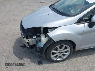 2019 Ford Fiesta SE z VIN 3FADP4EJ9KM107124, wystawiony jako IAAI lot #42067464 z przebiegiem 89 076 mil mil oraz . Historia ofert i sprzedaży dostępna na DreamBid. Obrazek 18.