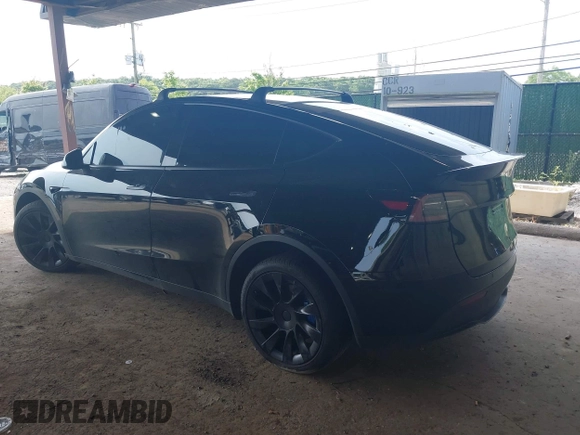 2023 Tesla Model Y Long Range with VIN 7SAYGDEE3PA185778, listed as a IAAI auction lot 39721611 with 11,986 mi miles and . Bid and sale history available at DreamBid. Image 3.