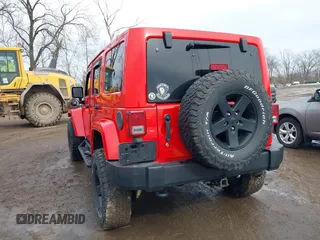 2015 Jeep Wrangler Unlimited Sahara with VIN 1C4BJWEG3FL590491, listed as a IAAI auction lot 41642219 with 148,759 mi miles. Bid and sale history available at carsss.com. Image 3.