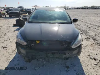 2017 Ford Focus SE with VIN 1FADP3F26HL331253, listed as a Copart auction lot 50869865 with 60,776 mi miles and Salvage title. Bid and sale history available at DreamBid. Image 5.