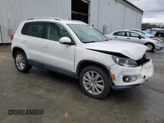 2012 Volkswagen Tiguan S with VIN WVGBV7AX5CW559037, listed as a Copart auction lot 51073435 with 56,620 mi miles and Salvage Title. Bid and sale history available at DreamBid. Image 4.