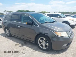 2012 Honda Odyssey Touring with VIN 5FNRL5H90CB088536, listed as a IAAI auction lot 42102008 with 283,350 mi miles and . Bid and sale history available at DreamBid. Image 1.