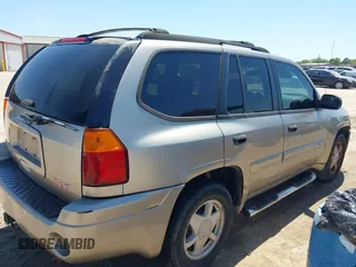 2003 GMC Envoy SLT with VIN 1GKDS13S732150215, listed as a IAAI auction lot 42048209 with 329,719 mi miles. Bid and sale history available at carsss.com. Image 4.