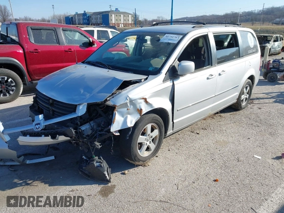 2010 Dodge Grand Caravan SXT with VIN 2D4RN5D17AR154594, listed as a IAAI auction lot 41751767 with Not Provided miles and . Bid and sale history available at DreamBid. Image 2.