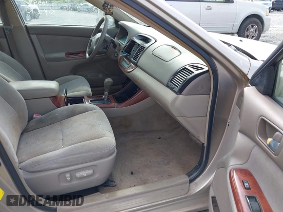 2004 Toyota Camry LE with VIN 4T1BF30K24U570599, listed as a IAAI auction lot 42107715 with 324,191 mi miles and . Bid and sale history available at DreamBid. Image 5.