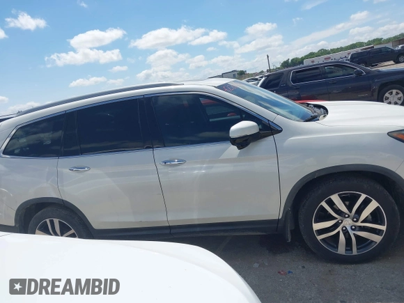 2017 Honda Pilot Touring with VIN 5FNYF6H92HB054145, listed as a IAAI auction lot 42200391 with 70,096 mi miles and . Bid and sale history available at DreamBid. Image 13.