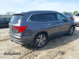 2017 Honda Pilot Touring with VIN 5FNYF5H9XHB046479, listed as a IAAI auction lot 41941449 with 162,554 mi miles. Bid and sale history available at carsss.com. Image 4.