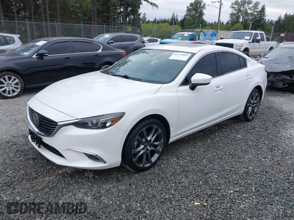 2017 Mazda 6 Grand Touring with VIN JM1GL1X51H1142473, listed as a IAAI auction lot 42234809 with 101,633 mi miles and . Bid and sale history available at DreamBid. Image 18.
