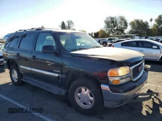 2001 GMC Yukon SLT z VIN 1GKEC13T41J148550, wystawiony jako Copart lot #80580964 z przebiegiem Nie podano mil oraz Szkoda całkowita • Salvage title. Historia ofert i sprzedaży dostępna na DreamBid. Obrazek 4.