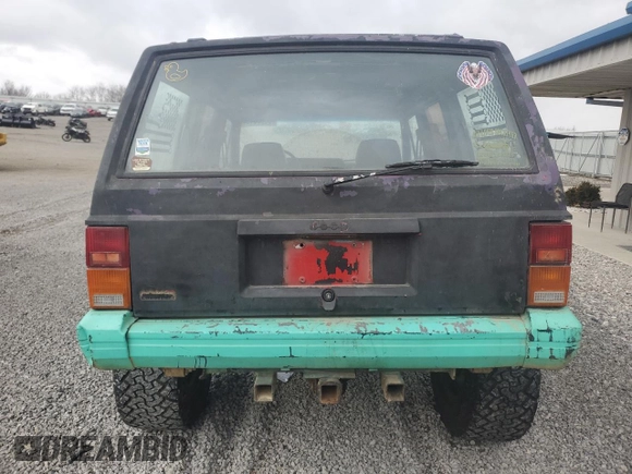 1993 Jeep Cherokee Sport with VIN 1J4FJ68S6PL506709, listed as a Copart auction lot 86638434 with 253,923 mi miles and Salvage Title. Bid and sale history available at carsss.com. Image 6.