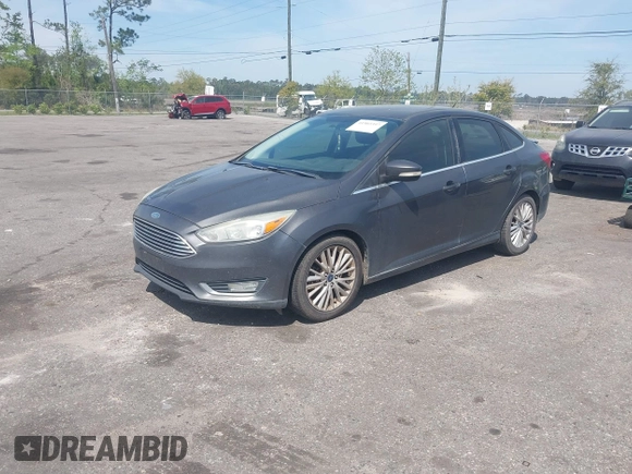 2015 Ford Focus Titanium with VIN 1FADP3J24FL277732, listed as a IAAI auction lot 41903397 with 238,138 mi miles and . Bid and sale history available at carsss.com. Image 2.