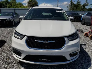 2023 Chrysler Pacifica Hybrid Touring L z VIN 2C4RC1L74PR558768, wystawiony jako Copart lot #61407555 z przebiegiem 70 387 mil mil oraz Czysty tytuł • Clean title. Historia ofert i sprzedaży dostępna na DreamBid. Obrazek 5.