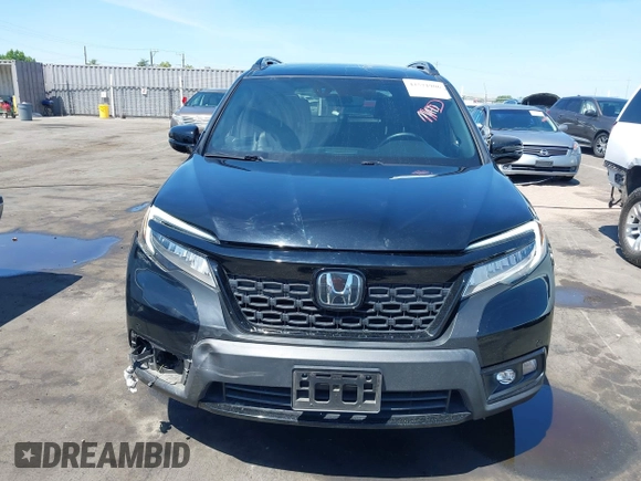 2021 Honda Passport Elite with VIN 5FNYF8H07MB003506, listed as a IAAI auction lot 42571906 with 42,323 mi miles and . Bid and sale history available at DreamBid. Image 13.