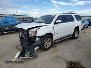 2015 GMC Yukon SLE with VIN 1GKS2AKCXFR744083, listed as a Copart auction lot 82003234 with 150,926 mi miles and Salvage Title. Bid and sale history available at carsss.com. Image 1.