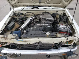 1993 Toyota Pickup DLX z VIN 4TAVN13D1PZ122508, wystawiony jako Copart lot #56737535 z przebiegiem 291 854 mil mil oraz Tytuł czysty. Historia ofert i sprzedaży dostępna na DreamBid. Obrazek 11.