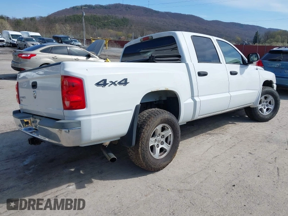 2006 Dodge Dakota SLT z VIN 1D7HW48K06S676241, wystawiony jako IAAI lot #41986300 z przebiegiem 112 215 mil mil oraz . Historia ofert i sprzedaży dostępna na DreamBid. Obrazek 4.