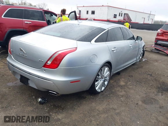 2015 Jaguar XJ with VIN SAJWA2GZ8F8V83551, listed as a IAAI auction lot 41909403 with 112,098 mi miles. Bid and sale history available at carsss.com. Image 4.