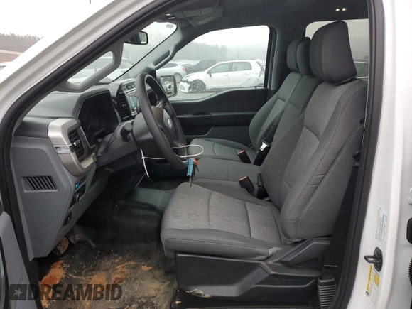 2023 Ford F-150 XL with VIN 1FTFW1E86PKG13350, listed as a Copart auction lot 87603215 with 12,534 mi miles and Salvage title. Bid and sale history available at DreamBid. Image 7.