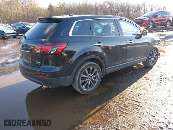 2014 Mazda CX-9 Grand Touring with VIN JM3TB3DV4E0444558, listed as a IAAI auction lot 41538130 with 113,050 mi miles and . Bid and sale history available at DreamBid. Image 4.