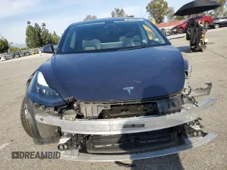 2023 Tesla Model 3 с VIN 5YJ3E1EA9PF412192, выставлен на аукционе Copart как лот 52122045 с пробегом 72 230 миль миль и Списание • Salvage title. История ставок и продаж доступна на DreamBid. Изображение 5.