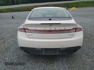 2015 Lincoln MKZ z VIN 3LN6L2G95FR626407, wystawiony jako Copart lot #63658825 z przebiegiem 121 361 mil mil oraz Szkoda całkowita • Salvage title. Historia ofert i sprzedaży dostępna na DreamBid. Obrazek 6.