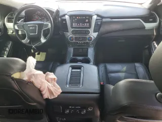 2016 GMC Yukon XL SLT with VIN 1GKS2GKC6GR228033, listed as a Copart auction lot 52450055 with 135,476 mi miles and Salvage Title. Bid and sale history available at DreamBid. Image 8.