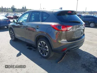 2016 Mazda CX-5 Grand Touring with VIN JM3KE2DYXG0773663, listed as a IAAI auction lot 41896367 with 86,571 mi miles and . Bid and sale history available at DreamBid. Image 3.