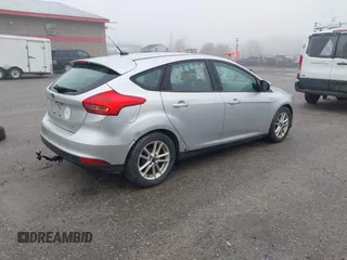 2015 Ford Focus SE with VIN 1FADP3K2XFL364856, listed as a IAAI auction lot 42190028 with 170,436 mi miles. Bid and sale history available at carsss.com. Image 4.