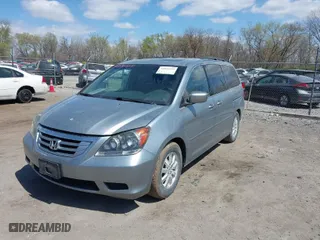 2009 Honda Odyssey EX-L with VIN 5FNRL38629B013033, listed as a IAAI auction lot 42034354 with 257,254 mi miles. Bid and sale history available at carsss.com. Image 2.