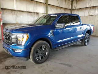 2023 Ford F-150 XL with VIN 1FTEW1C85PKD71889, listed as a Copart auction lot 87242544 with 13,739 mi miles and Salvage Title. Bid and sale history available at carsss.com. Image 1.