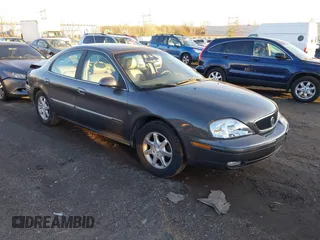2003 Mercury Sable LS Premium with VIN 1MEFM55S03G606625, listed as a IAAI auction lot 41070883 with 100,002 mi miles. Bid and sale history available at carsss.com. Image 1.