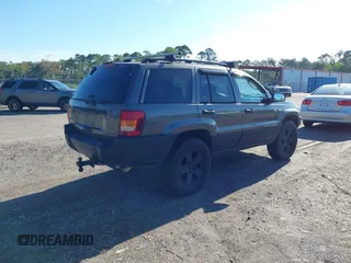 2002 Jeep Grand Cherokee z VIN 1J4GX38S32C238339, wystawiony jako IAAI lot #42653341 z przebiegiem 264 189 mil mil oraz . Historia ofert i sprzedaży dostępna na DreamBid. Obrazek 4.