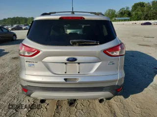 2013 Ford Escape SE z VIN 1FMCU9G92DUD07397, wystawiony jako Copart lot #63110315 z przebiegiem 167 296 mil mil oraz Czysty tytuł • Clean title. Historia ofert i sprzedaży dostępna na DreamBid. Obrazek 6.